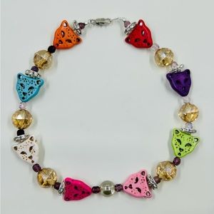 Haloed cheetah necklace.